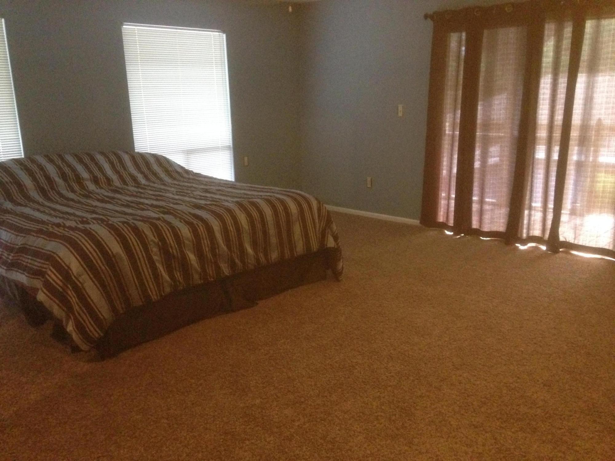 226 Country Club Road Shalimar, FL 32579 - Photo 27 of 35 a bed sitting in a bedroom next to a window