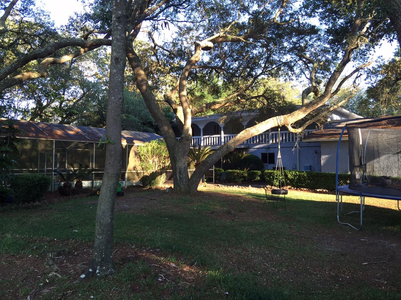 226 Country Club Road Shalimar, FL 32579 - Photo 33 of 35 a view of house with outdoor space and trees
