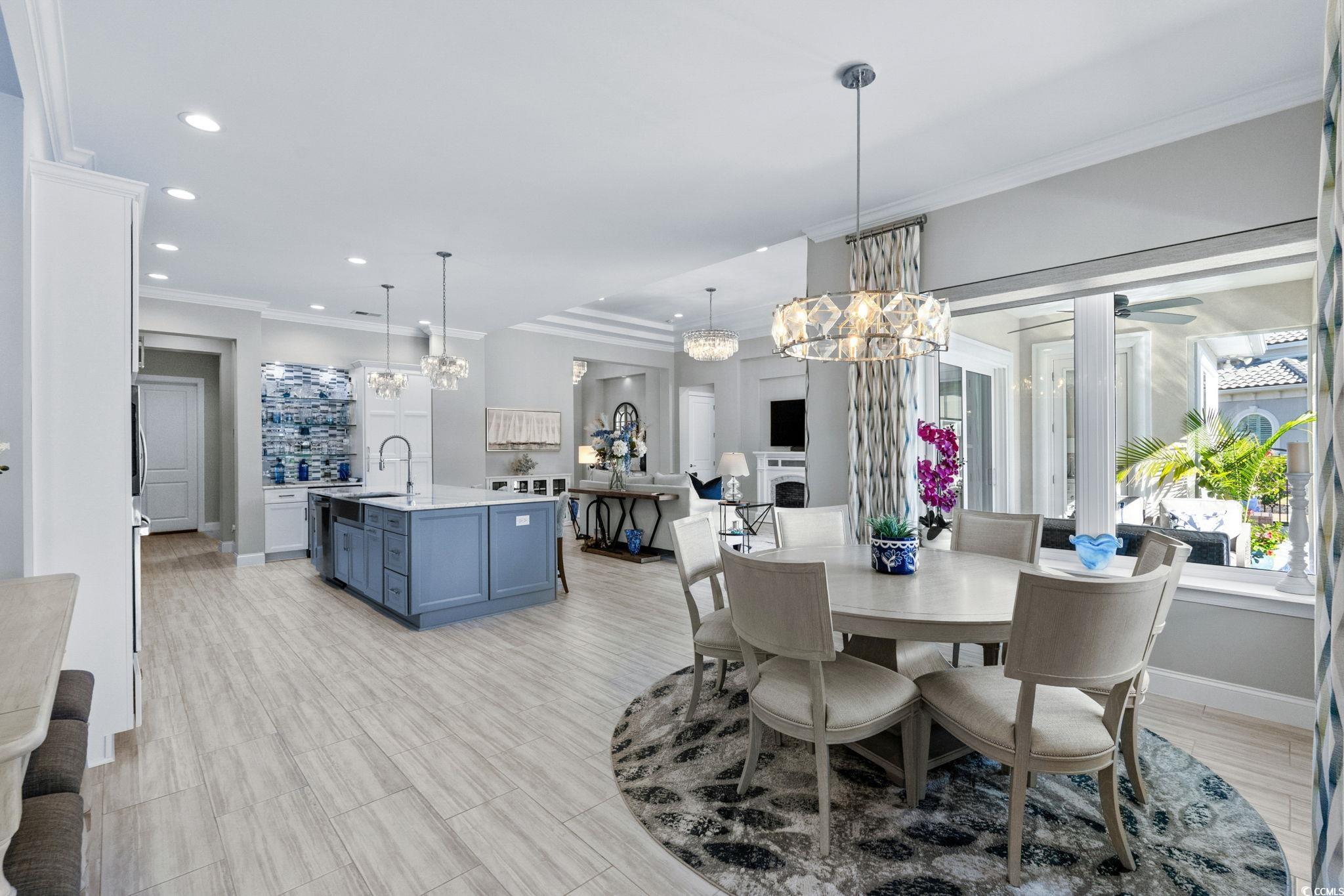 2225 Macerata Loop Myrtle Beach, SC 29579 - Photo 16 of 40 Dining room with crown molding, recessed lighting, a chandelier, and wood tiled floors