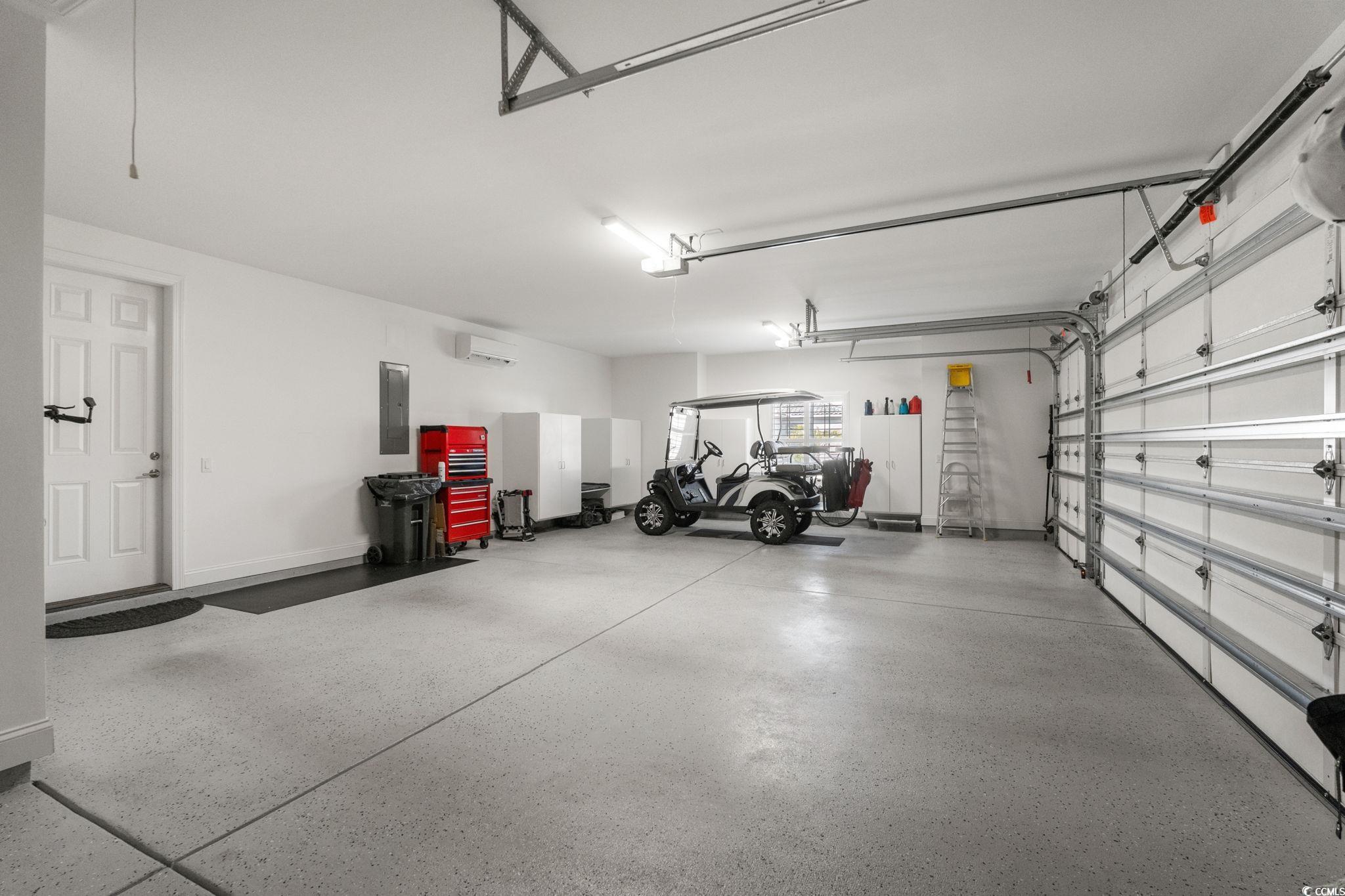 2225 Macerata Loop Myrtle Beach, SC 29579 - Photo 26 of 40 Garage featuring electric panel and a wall mounted AC