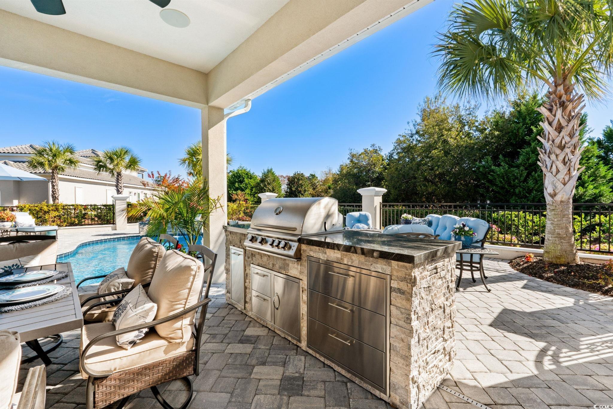 2225 Macerata Loop Myrtle Beach, SC 29579 - Photo 29 of 40 Fenced backyard featuring area for grilling, a patio, and a ceiling fan
