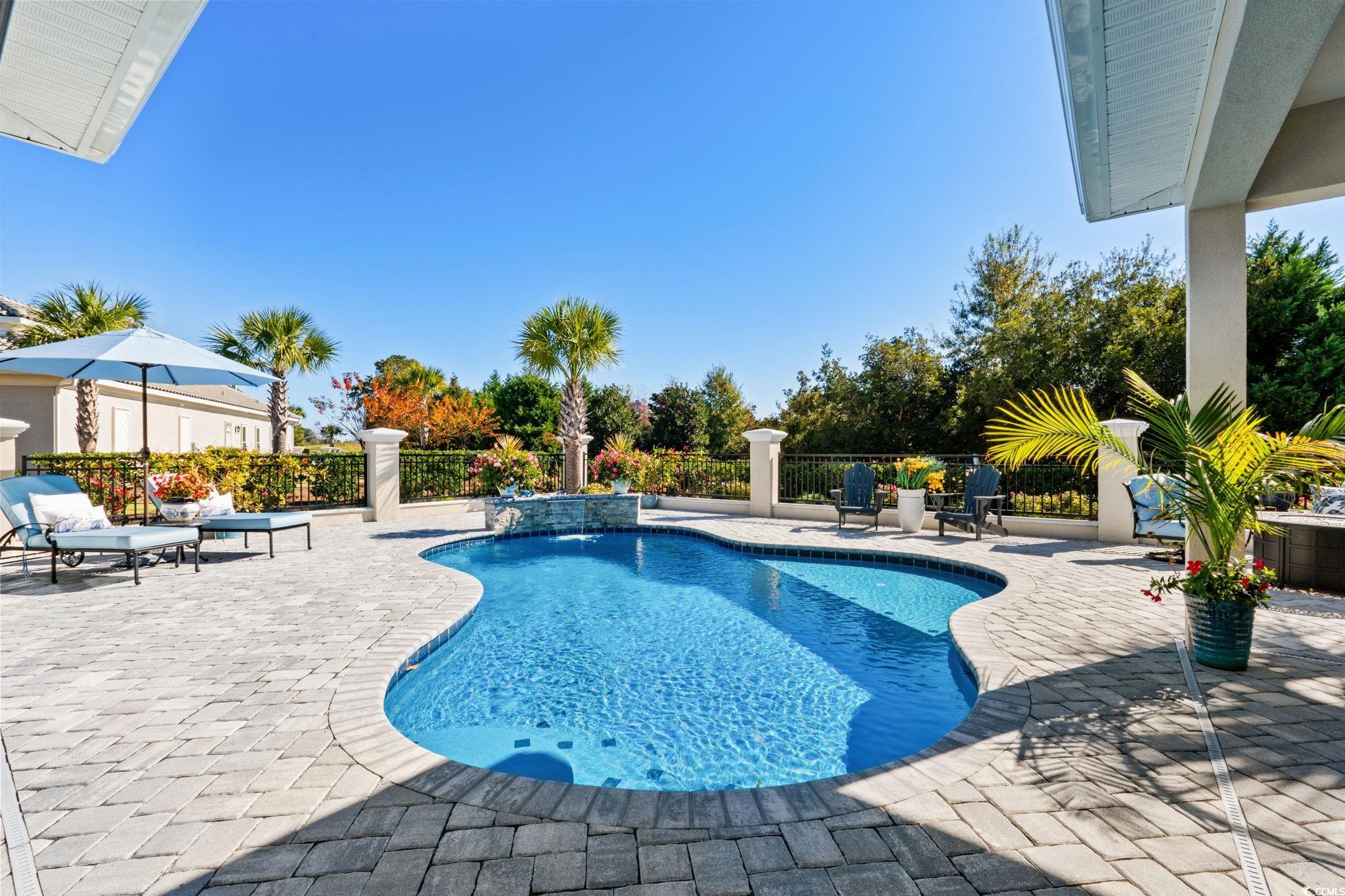 2225 Macerata Loop Myrtle Beach, SC 29579 - Photo 30 of 40 View of swimming pool featuring a patio