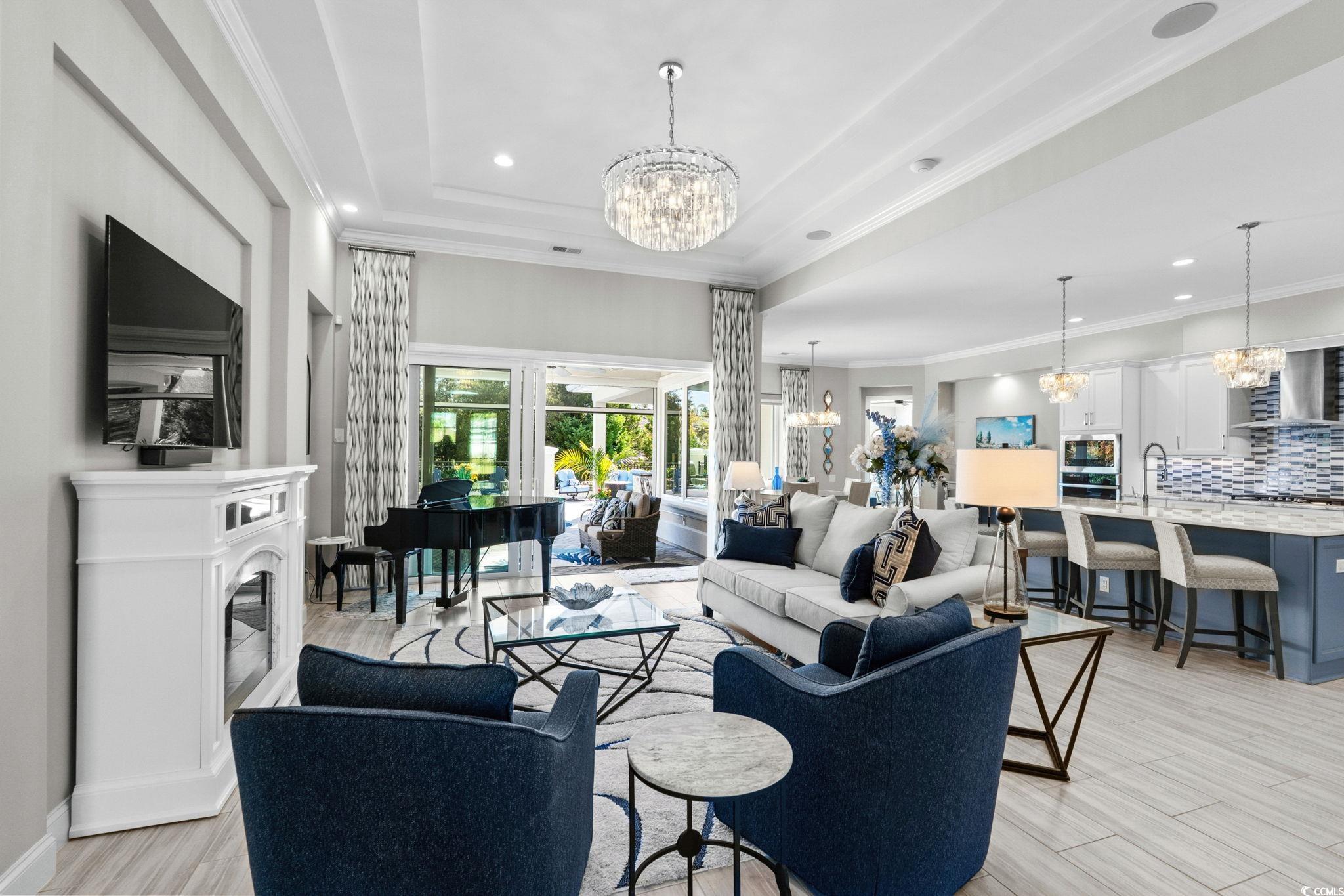 2225 Macerata Loop Myrtle Beach, SC 29579 - Photo 8 of 40 Living area featuring a chandelier, ornamental molding, recessed lighting, and wood finish floors