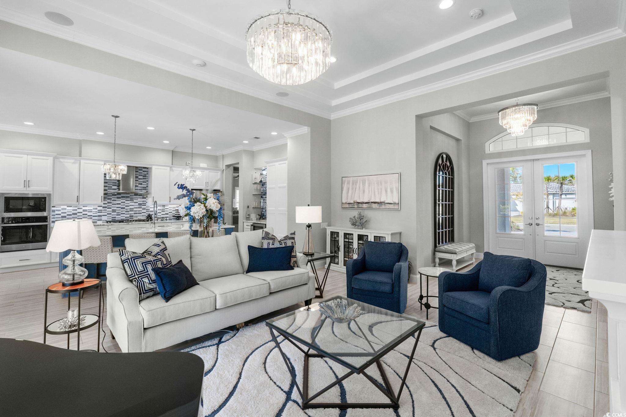 2225 Macerata Loop Myrtle Beach, SC 29579 - Photo 9 of 40 Living area with a chandelier, french doors, recessed lighting, and crown molding