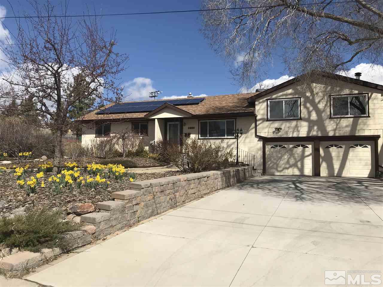 2601 Apollo Way Reno, NV 89503 - Photo 1 of 1 a front view of a house with garden