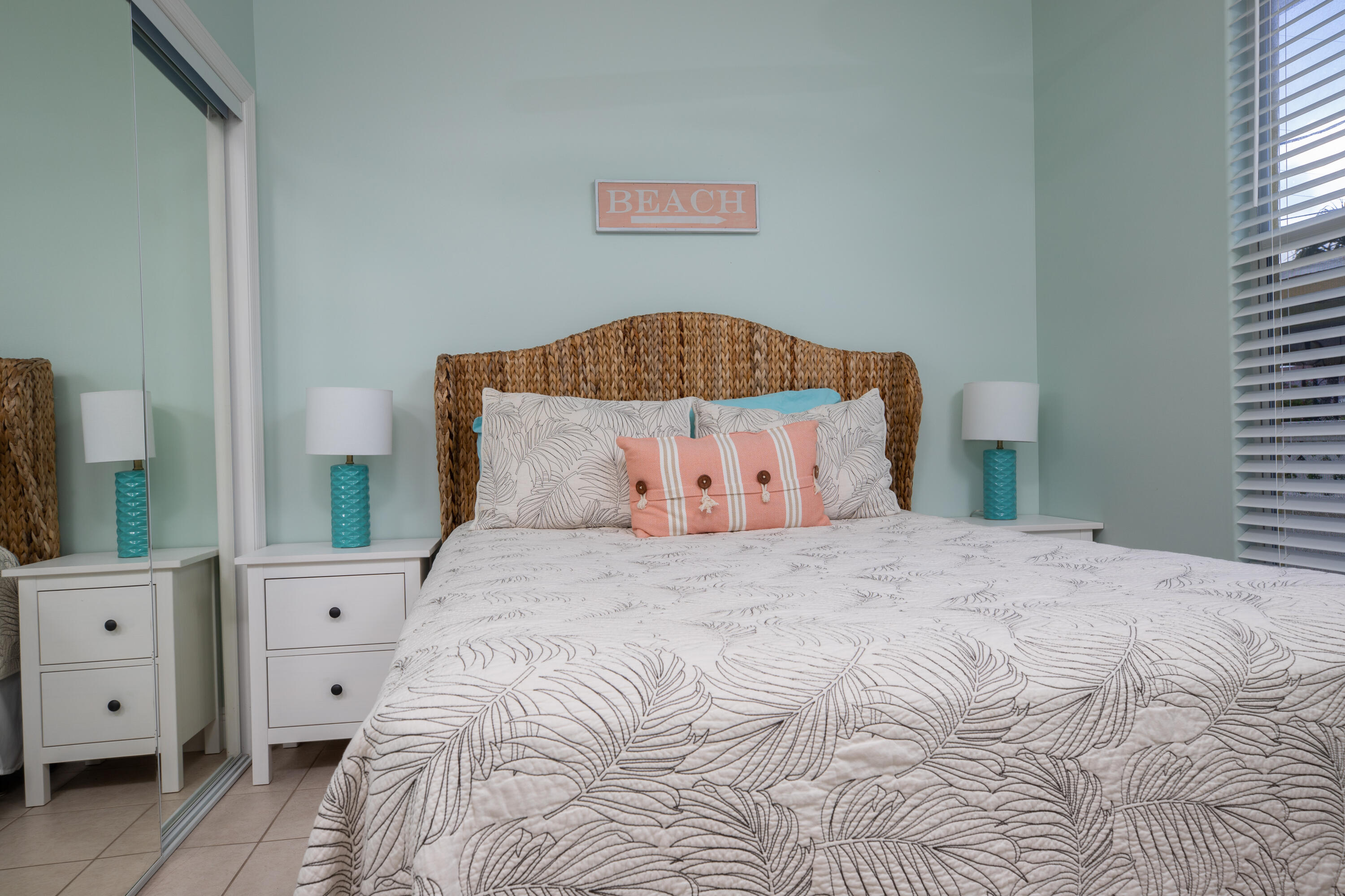 441 3rd Street Key Colony Beach, FL 33051 - Photo 11 of 29 a bedroom with a large bed and a flat tv screen on dresser