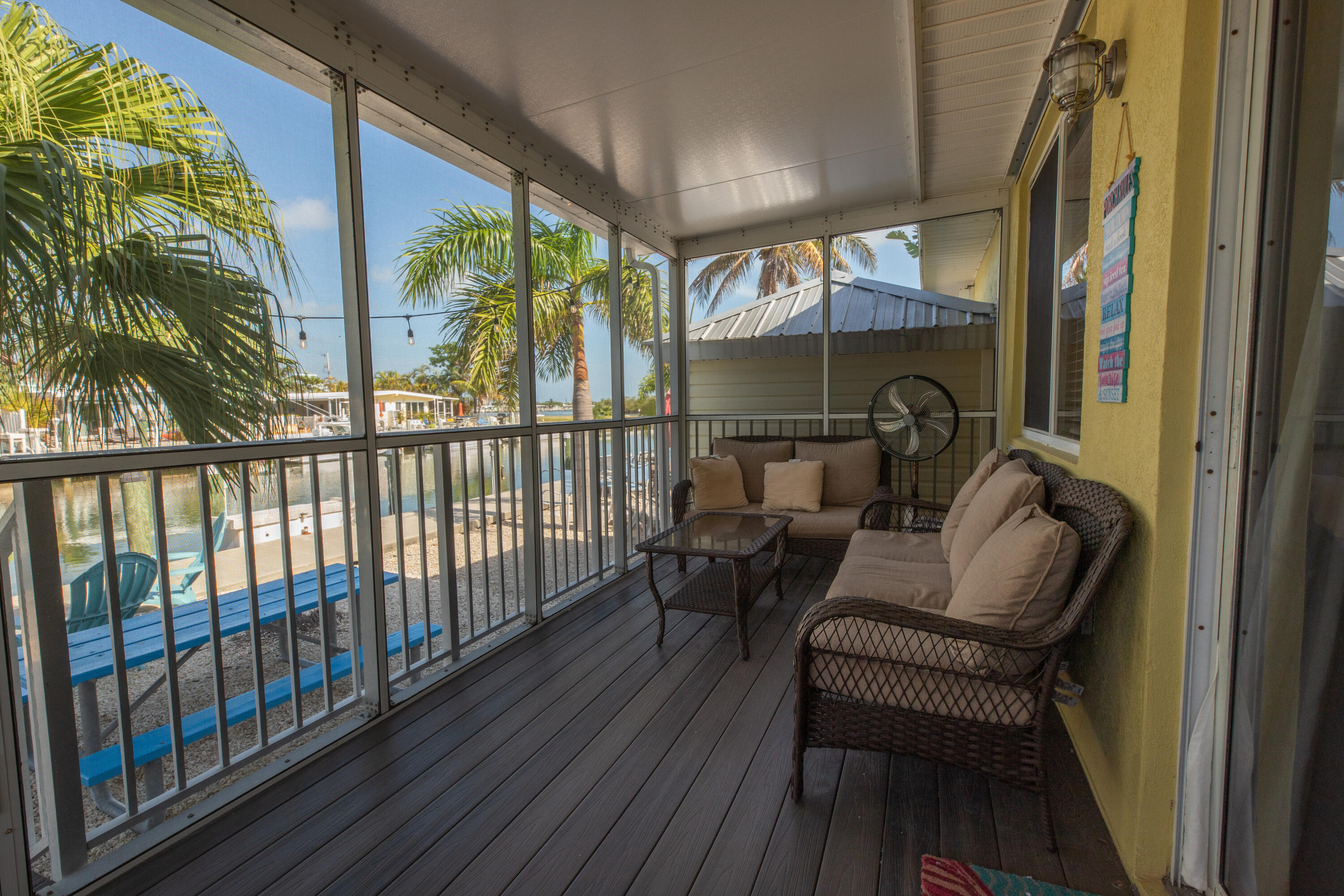 441 3rd Street Key Colony Beach, FL 33051 - Photo 14 of 29 a balcony with furniture and a potted plant