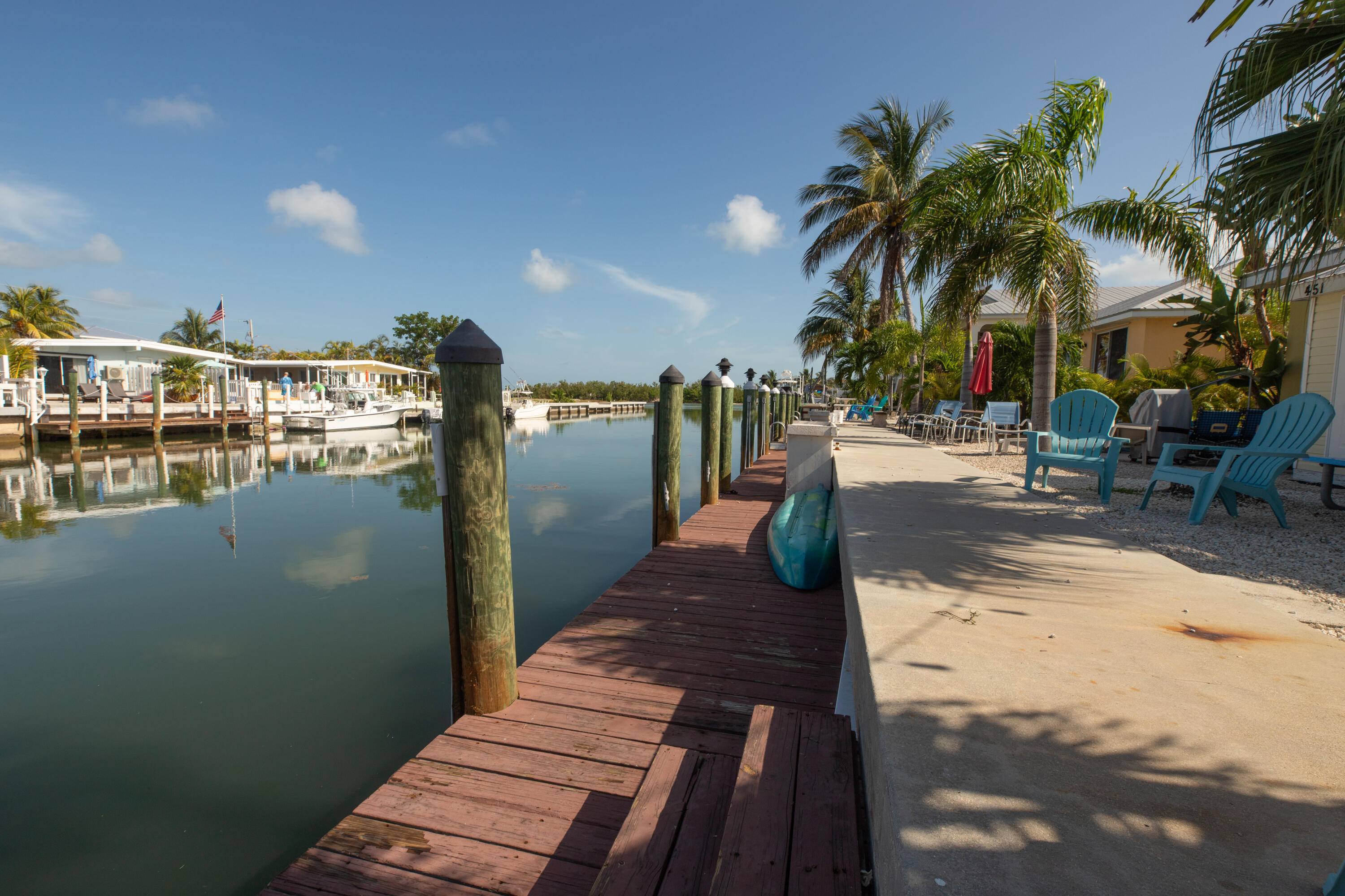 441 3rd Street Key Colony Beach, FL 33051 - Photo 16 of 29 a view of a swimming pool with outdoor seating