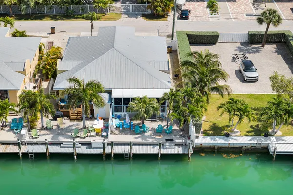 a view of a swimming pool with a patio and garden