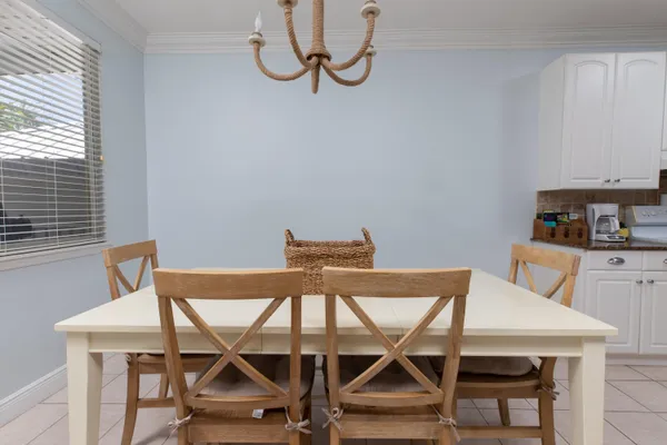 a view of a dining room with furniture and a window