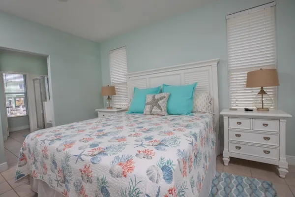 a bedroom with a bed and a dresser