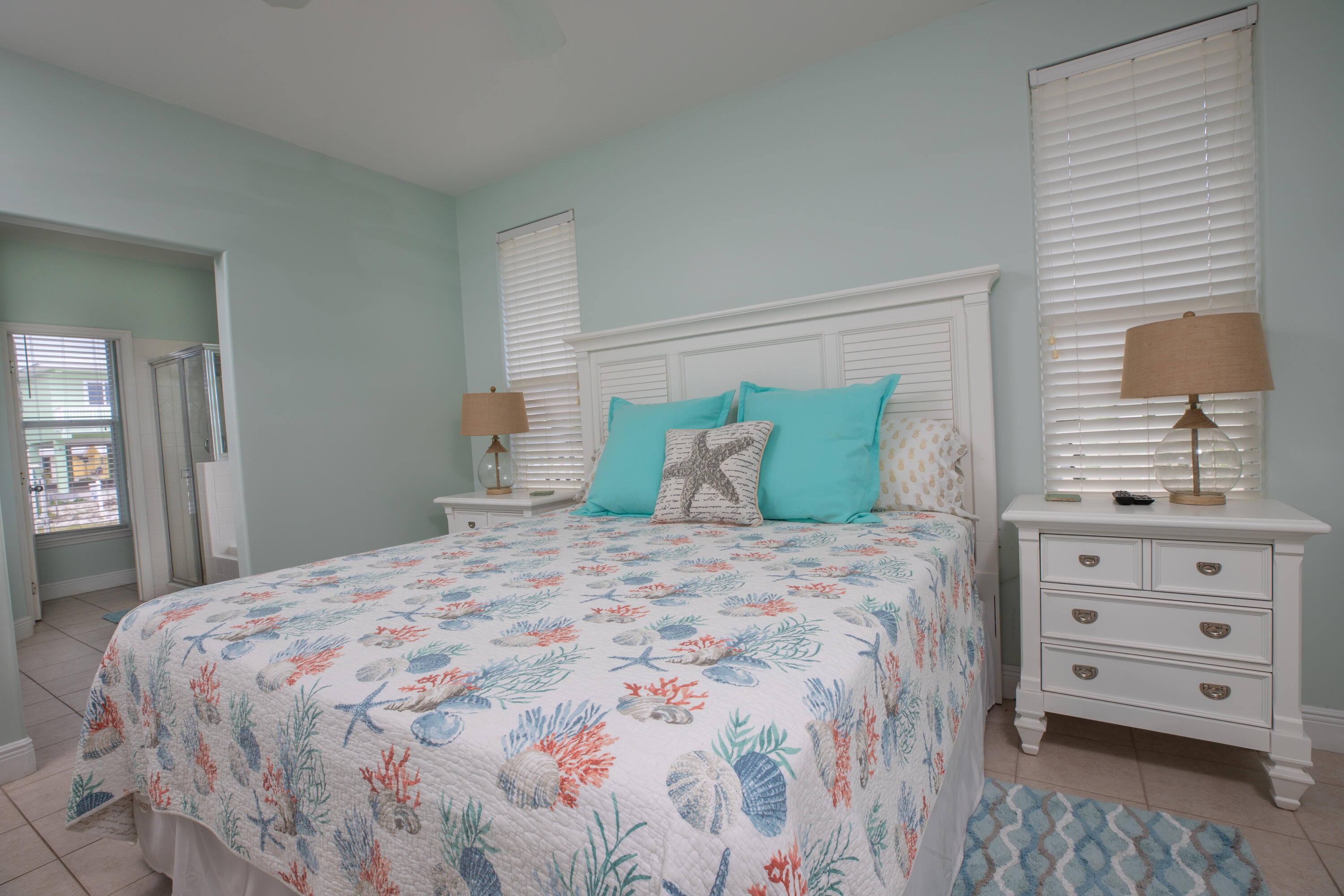 441 3rd Street Key Colony Beach, FL 33051 - Photo 6 of 29 a bedroom with a bed and a dresser
