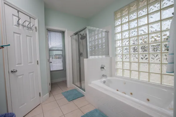 a bathroom with a bathtub and a shower