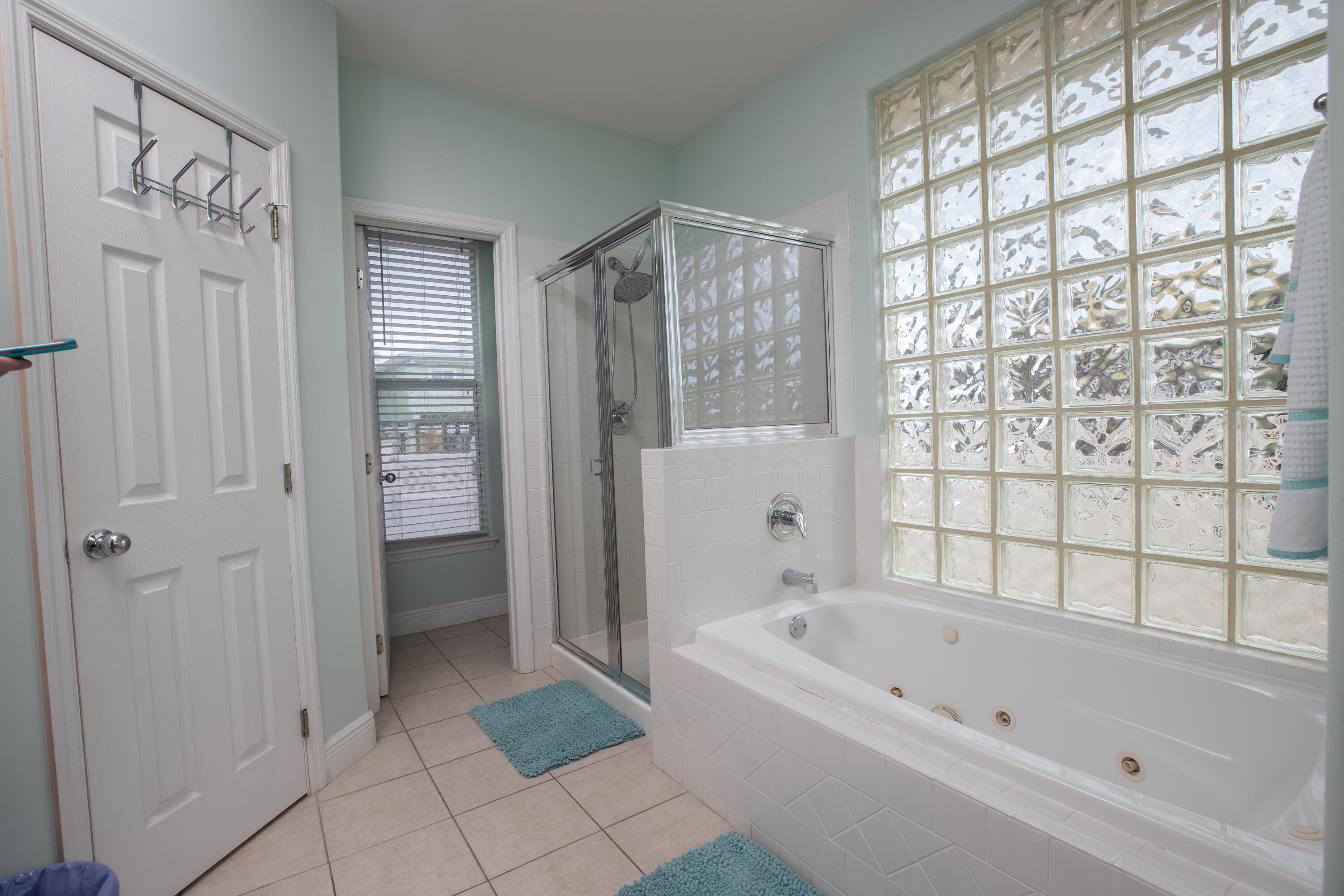 441 3rd Street Key Colony Beach, FL 33051 - Photo 9 of 29 a bathroom with a bathtub and a shower