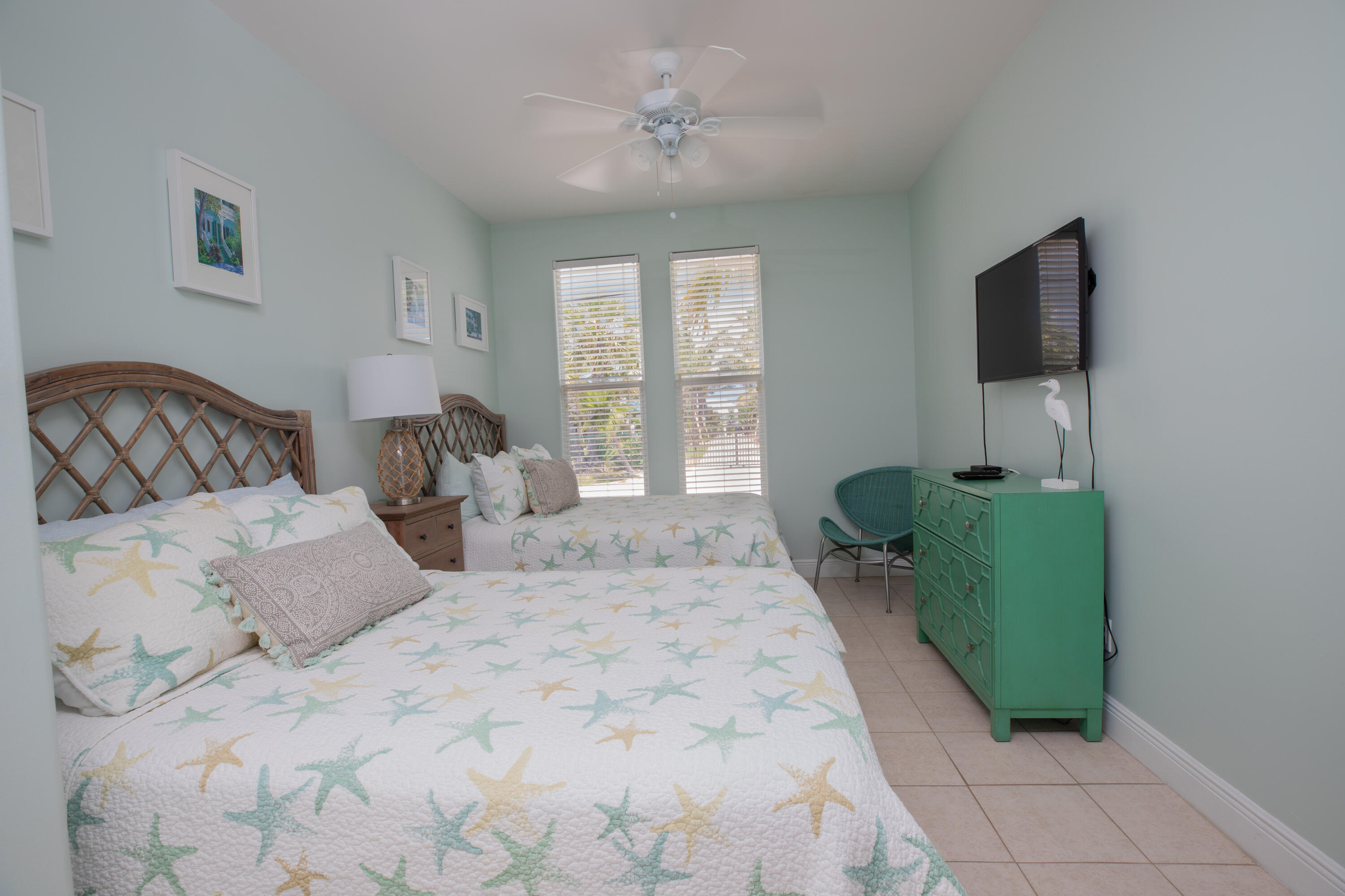 441 3rd Street Key Colony Beach, FL 33051 - Photo 10 of 29 a bedroom with a bed mirror and window