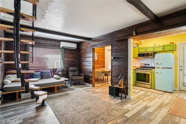 a living room with furniture stove and a fireplace