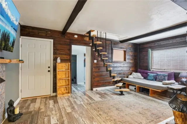 a bedroom with furniture and a window