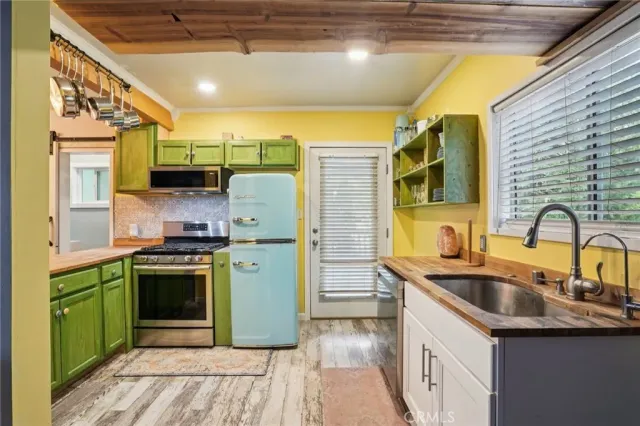 a kitchen with a stove and a refrigerator