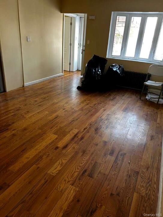 115-20 217th Street Queens, NY 11411 - Photo 2 of 8 a living room with furniture and a floor to ceiling window