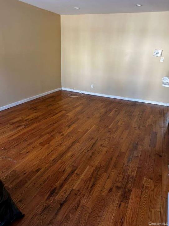 115-20 217th Street Queens, NY 11411 - Photo 3 of 8 a view of an empty room with wooden floor