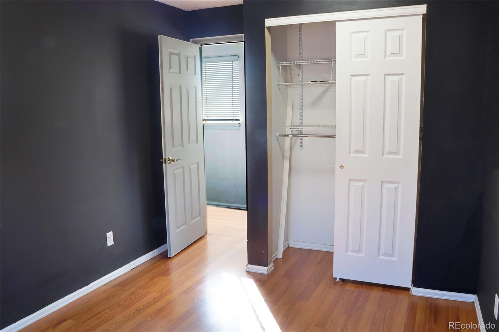 4939 East 124th Way Thornton, CO 80241 - Photo 13 of 24 a view of a hallway with wooden floor