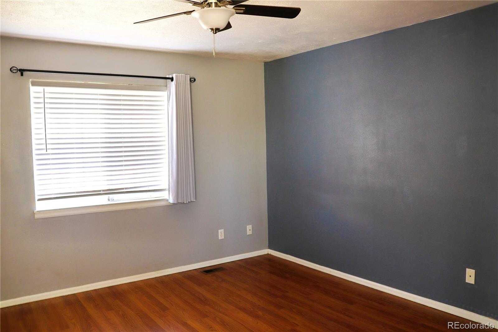 4939 East 124th Way Thornton, CO 80241 - Photo 9 of 24 an empty room with a window