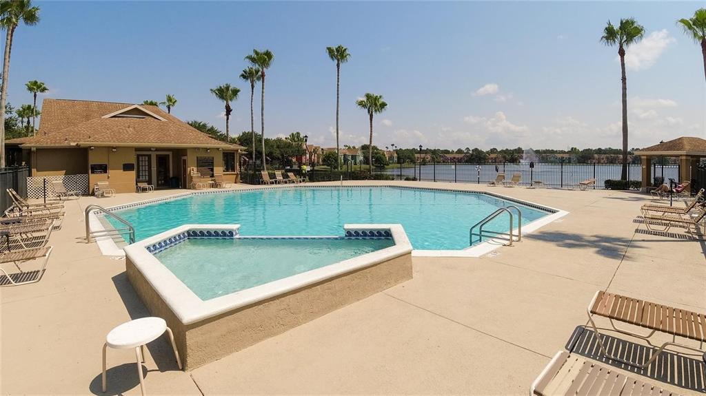 9704 Lake Chase Island Way, Unit 9704 Tampa, FL 33626 - Photo 18 of 23 a view of a patio with chairs
