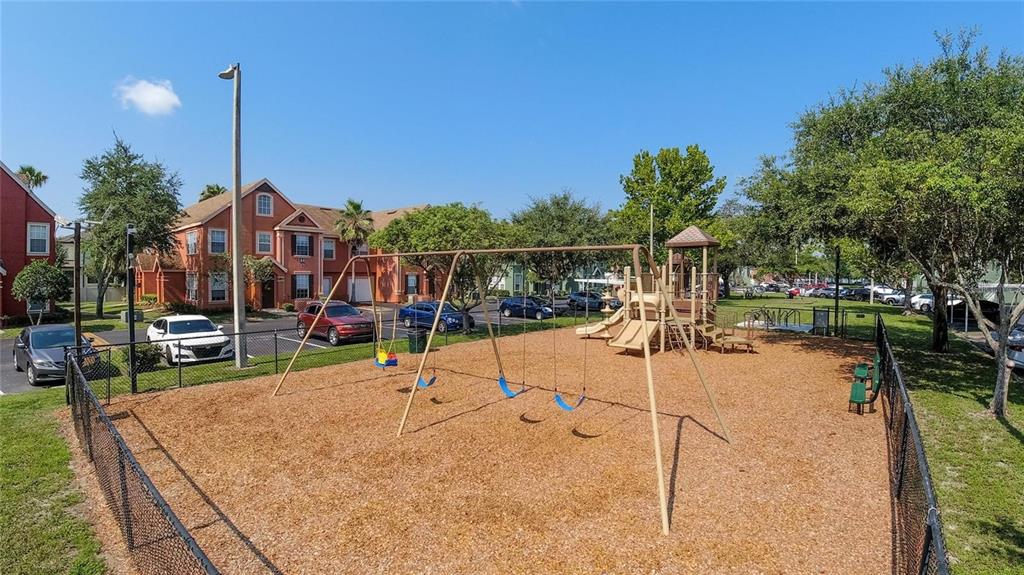 9704 Lake Chase Island Way, Unit 9704 Tampa, FL 33626 - Photo 20 of 23 a view of a swimming pool with a patio