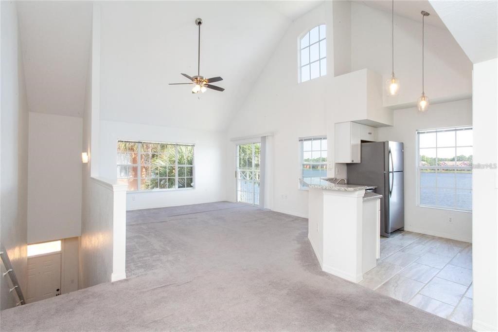 9704 Lake Chase Island Way, Unit 9704 Tampa, FL 33626 - Photo 4 of 23 a view of kitchen with refrigerator and window