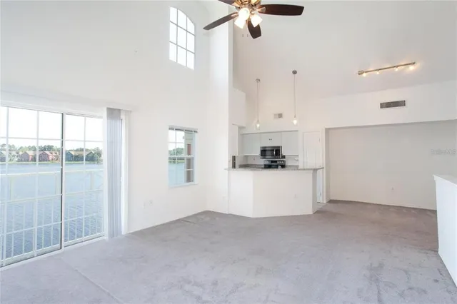 a view of kitchen with stainless steel appliances cabinets