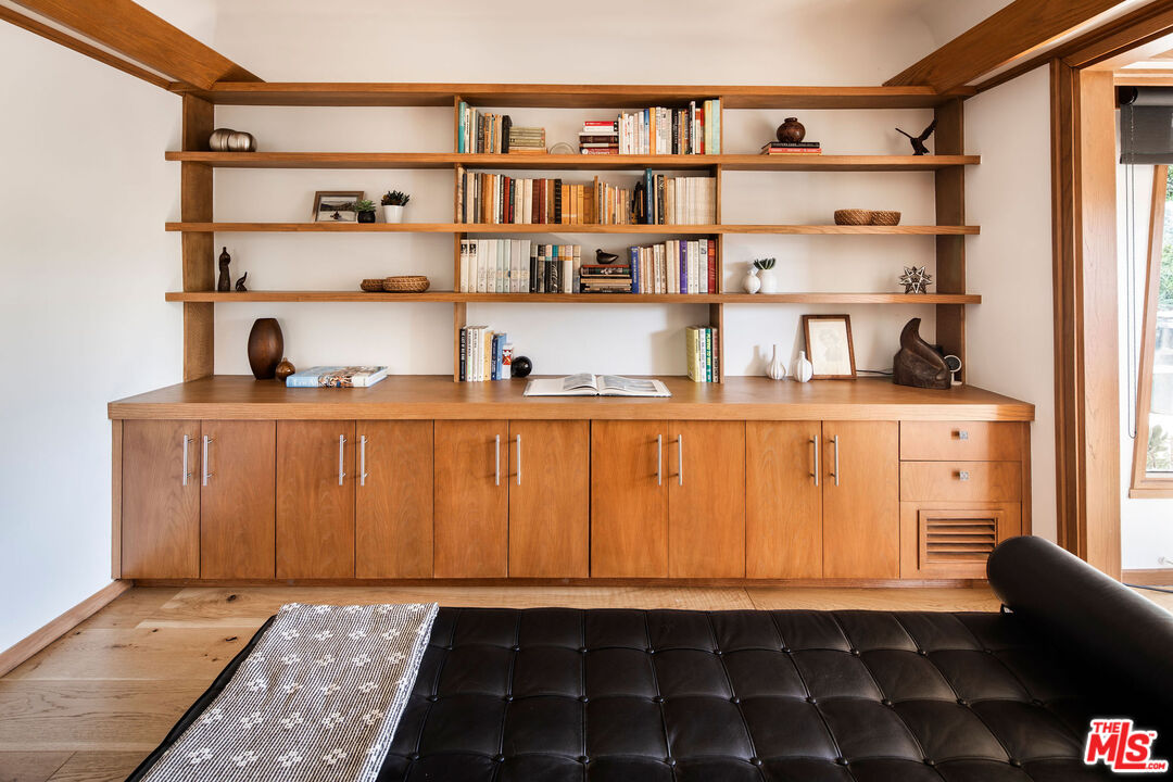 2371 Cove Avenue Los Angeles, CA 90039 - Photo 14 of 38 a room with a book shelf and a shelf