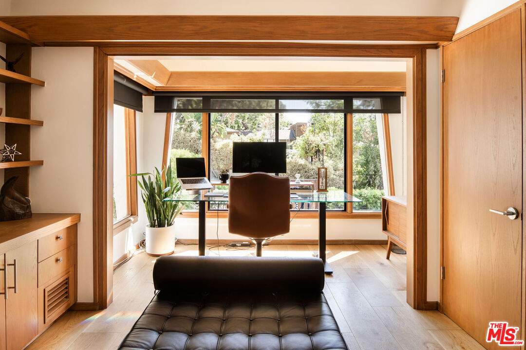 2371 Cove Avenue Los Angeles, CA 90039 - Photo 15 of 38 a living room with furniture and a floor to ceiling window