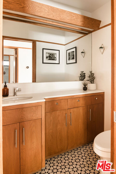 2371 Cove Avenue Los Angeles, CA 90039 - Photo 16 of 38 a bathroom with a sink a toilet and shower