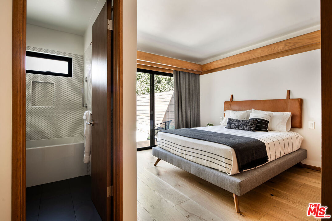 2371 Cove Avenue Los Angeles, CA 90039 - Photo 18 of 38 a bedroom with a bed and a window