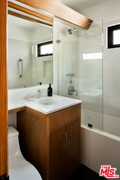 2371 Cove Avenue Los Angeles, CA 90039 - Photo 20 of 38 a bathroom with a sink and a mirror