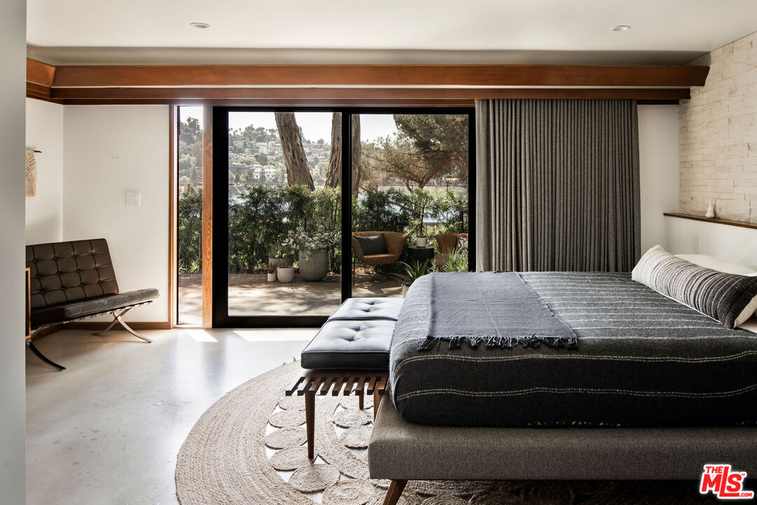 2371 Cove Avenue Los Angeles, CA 90039 - Photo 23 of 38 a bed sitting in a bedroom next to a window