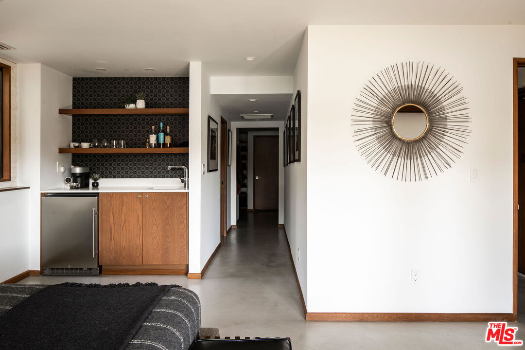2371 Cove Avenue Los Angeles, CA 90039 - Photo 25 of 38 a view of living room with a couch and a fireplace