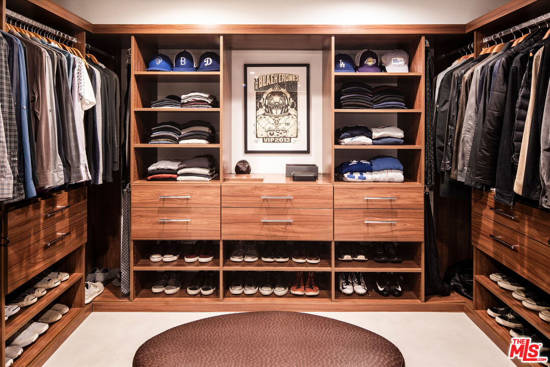 2371 Cove Avenue Los Angeles, CA 90039 - Photo 27 of 38 a view of walk in closet with clothes and shoes