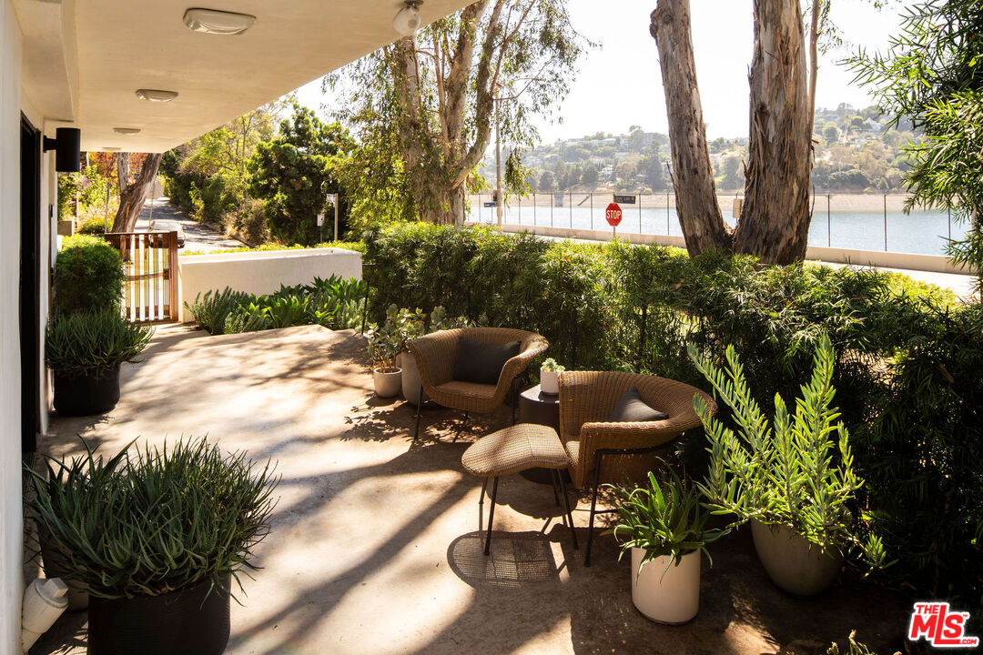 2371 Cove Avenue Los Angeles, CA 90039 - Photo 30 of 38 a view of a backyard with sitting area and garden