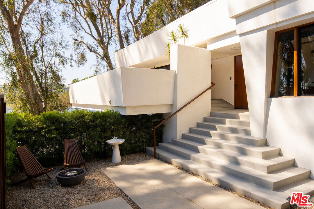 2371 Cove Avenue Los Angeles, CA 90039 - Photo 3 of 38 a view of a chairs and table in backyard