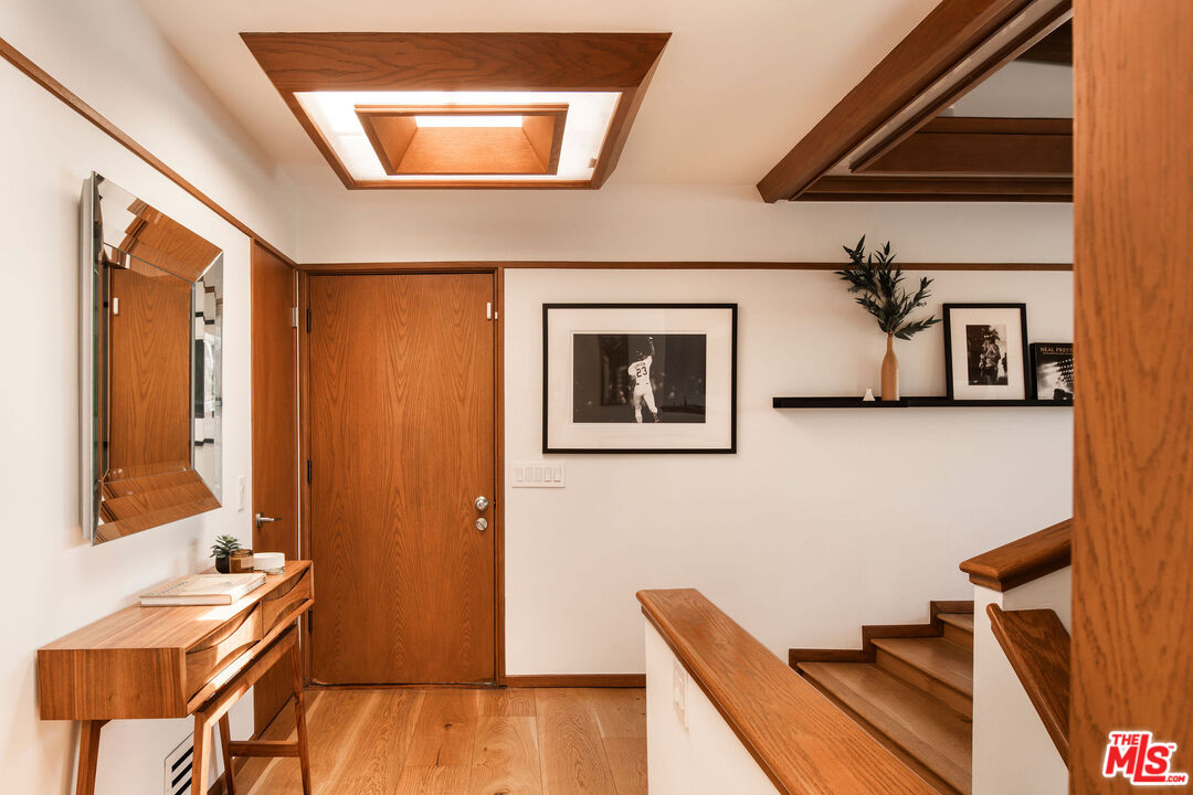 2371 Cove Avenue Los Angeles, CA 90039 - Photo 4 of 38 a view of a livingroom with furniture and staircase
