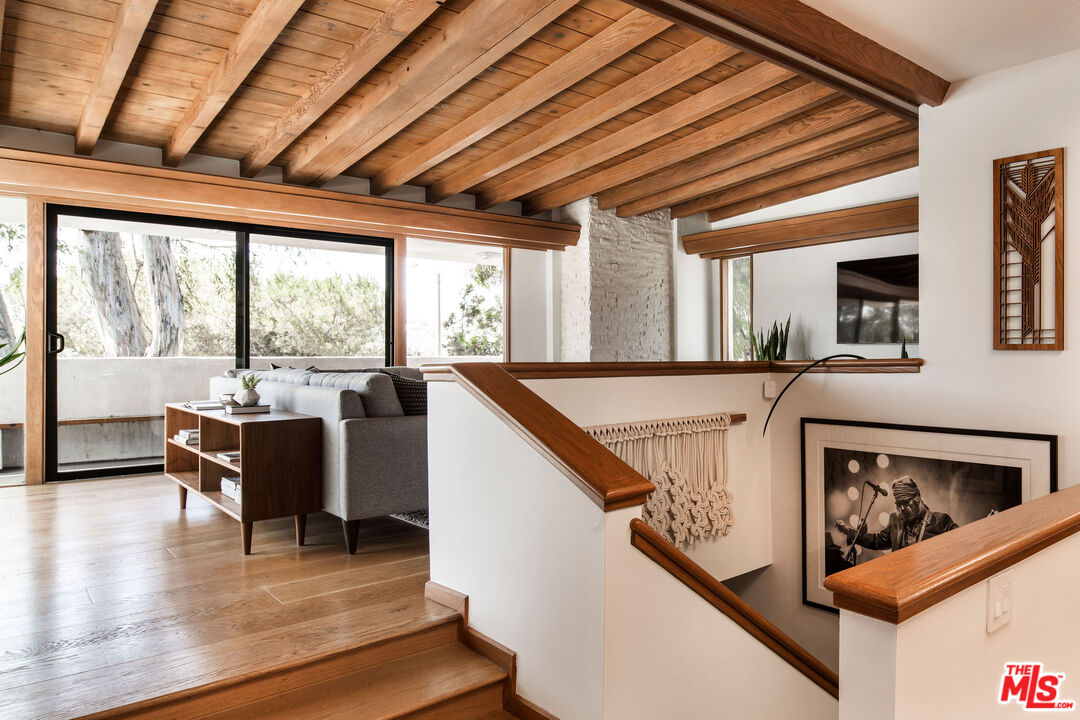 2371 Cove Avenue Los Angeles, CA 90039 - Photo 5 of 38 a living room with furniture stove and a large window