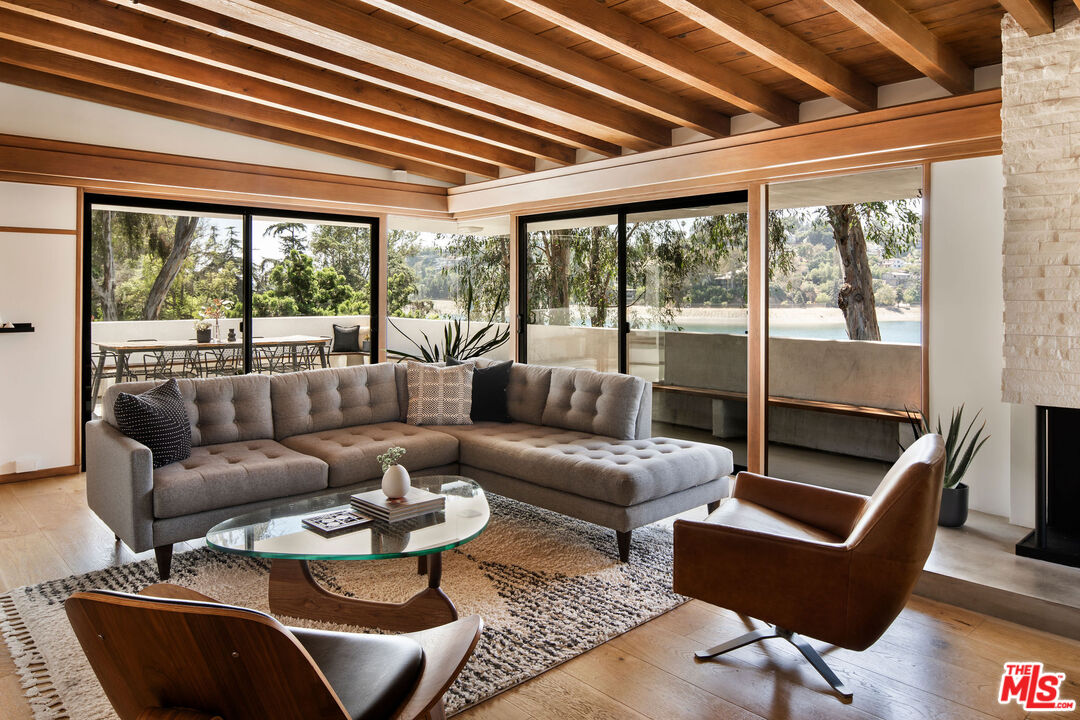 2371 Cove Avenue Los Angeles, CA 90039 - Photo 7 of 38 a living room with furniture potted plant and a large window