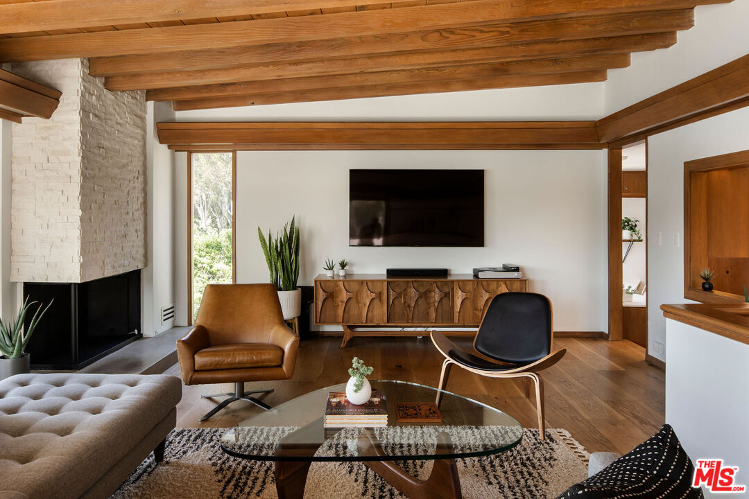 2371 Cove Avenue Los Angeles, CA 90039 - Photo 9 of 38 a living room with furniture and a flat screen tv