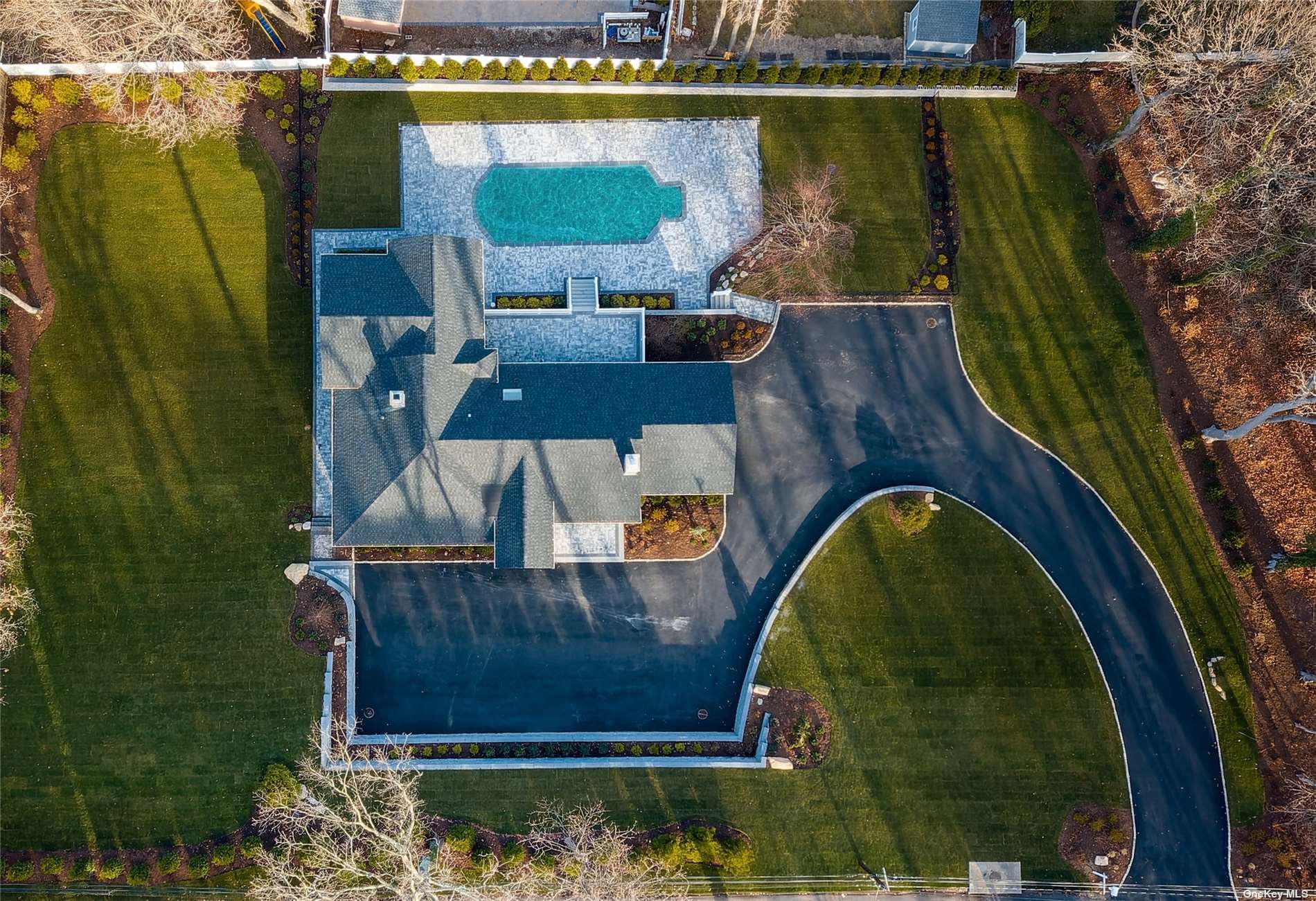 an aerial view of a house with swimming pool