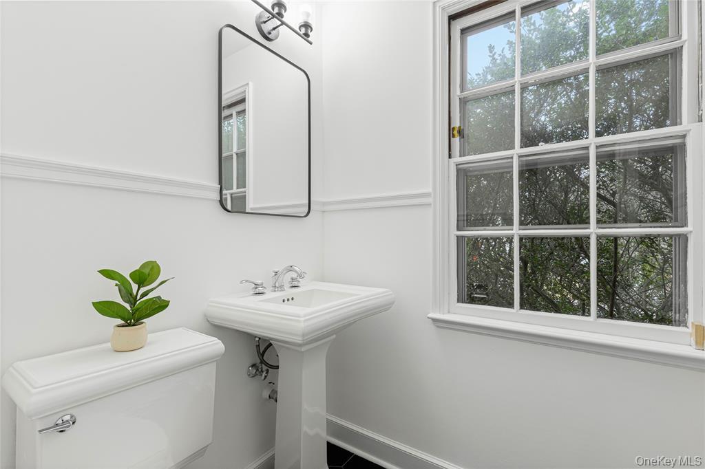 6 Fox Meadow Road Scarsdale, NY 10583 - Photo 8 of 20 Bathroom with toilet, a sink, and baseboards