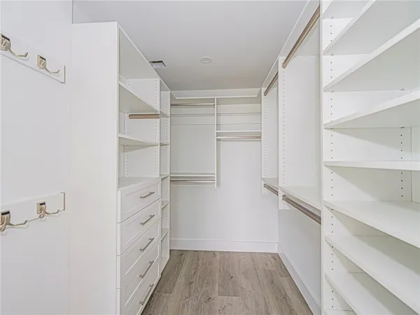 a kitchen with a sink and a stove top oven