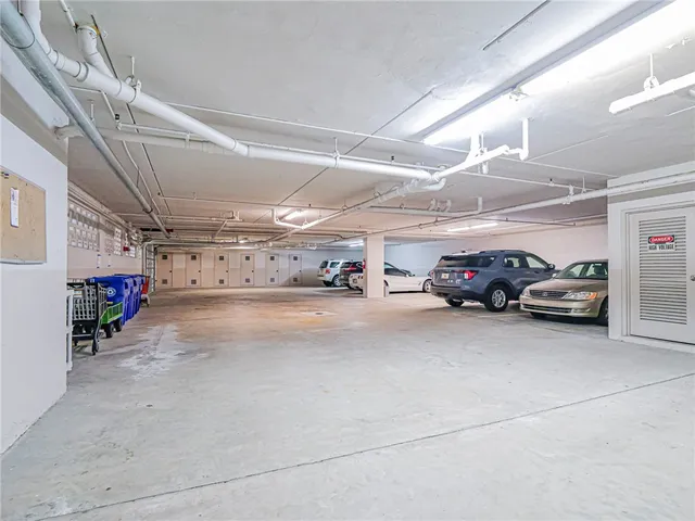 an aerial view of a house with a garden and lake view