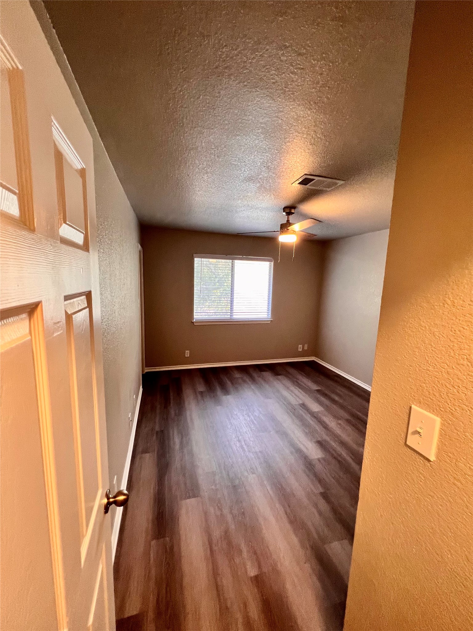 1801 Constantino Circle Austin, TX 78745 - Photo 16 of 22 a view of wooden floor and windows in a room