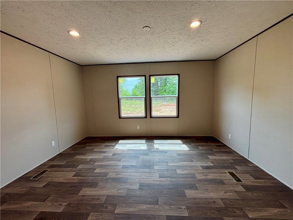 703 Double Springs Road Townville, SC 29689 - Photo 14 of 22 This versatile room offers ample natural light and durable flooring, ideal for various living arrangements.